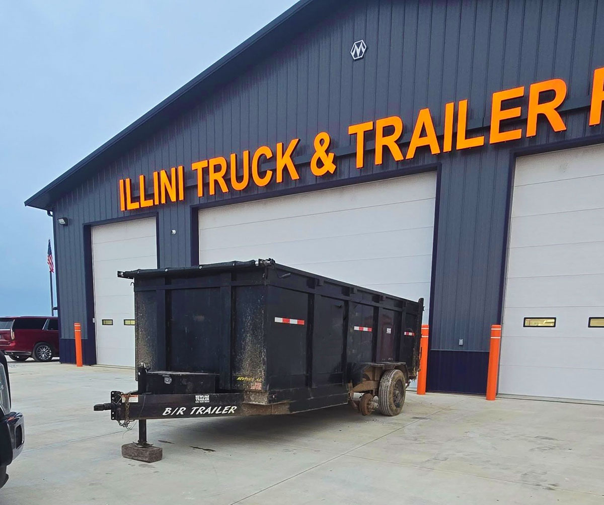 Dump trailer parked outside the Illini Truck & Trailer Repair building